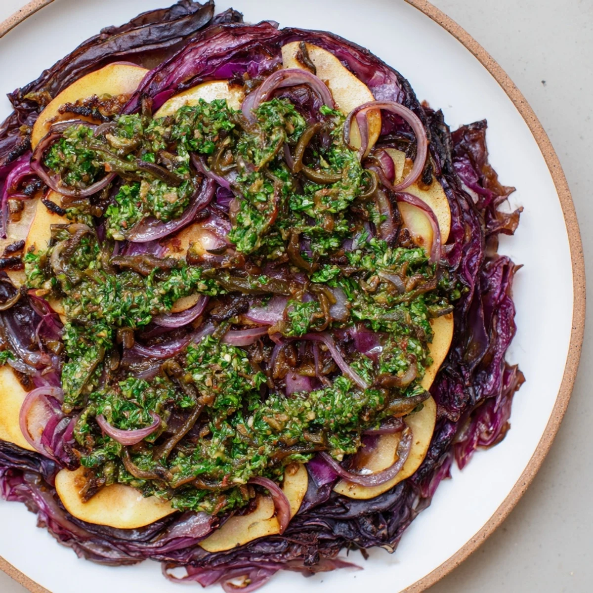 A steaming, vibrant Spiced Red Cabbage Bake with fresh salsa verde, ready to serve.