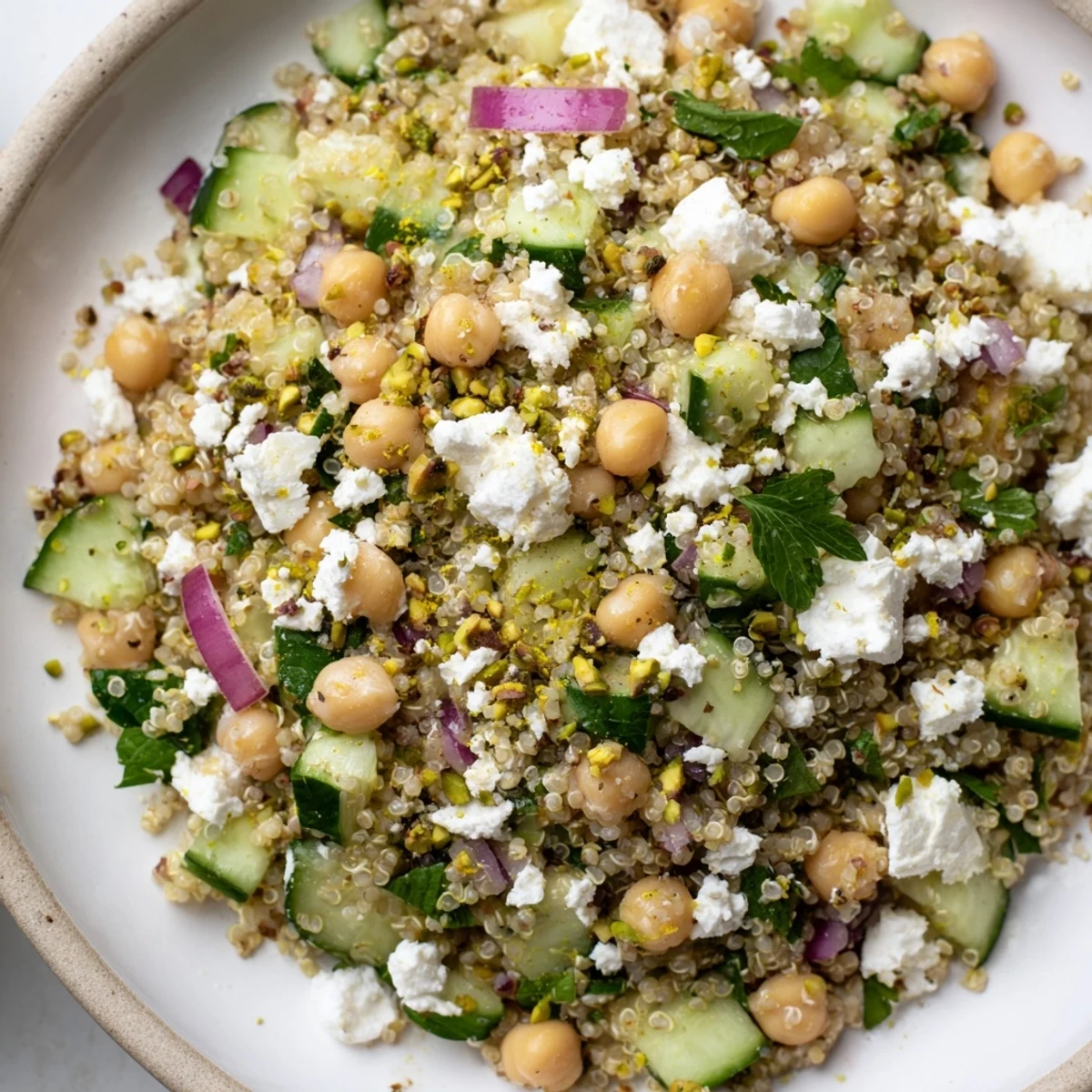 Bright image of the Jennifer Aniston Salad, showcasing refreshing cucumber and crumbled feta cheese with herbs.