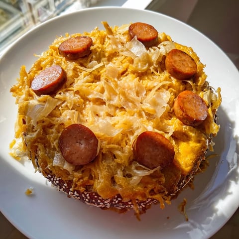 Golden brown Bratwurst & Sauerkraut Pie with bubbling filling, fresh from the oven, ready to serve.