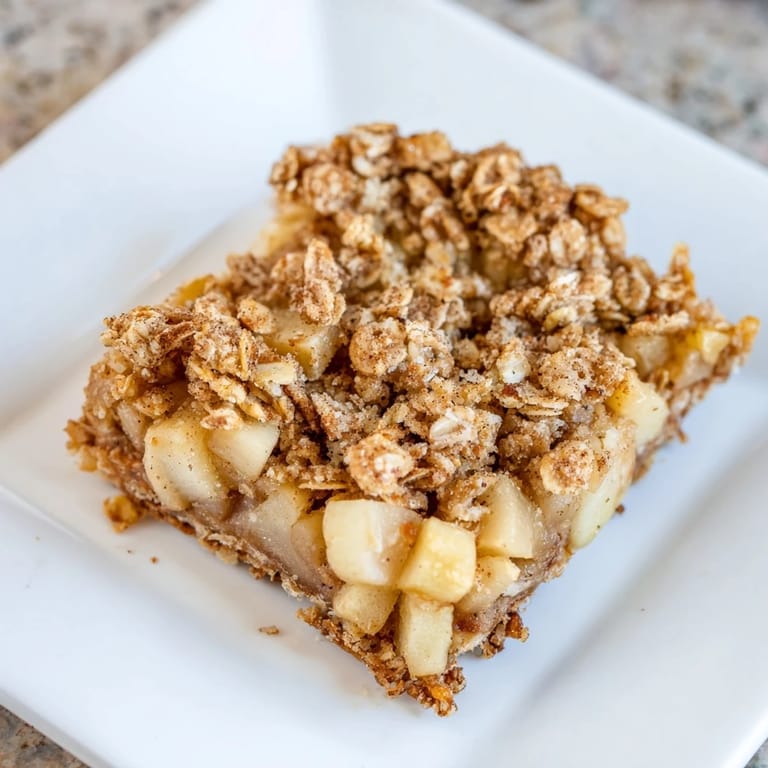 Fresh-baked apple-filled Apple Streusel Breakfast Bars, perfect with a hot coffee on a crisp day.