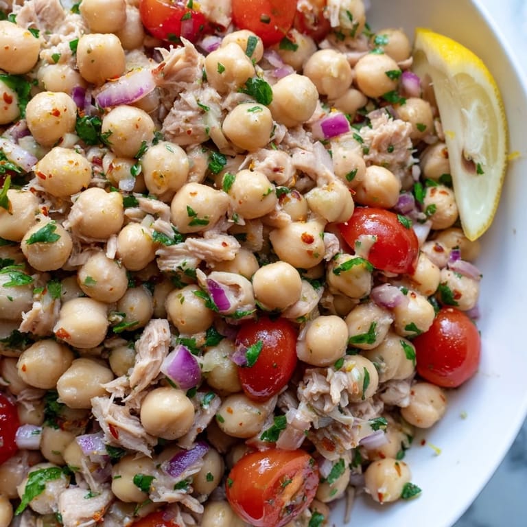 Freshly made Dense Chickpea and Tuna Salad, ready to serve with a drizzle of olive oil.