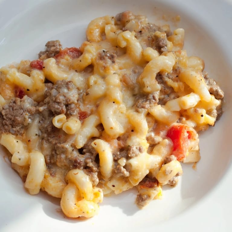 Homemade One-Pot Chili Mac recipe served hot, with a dollop of creamy sour cream.