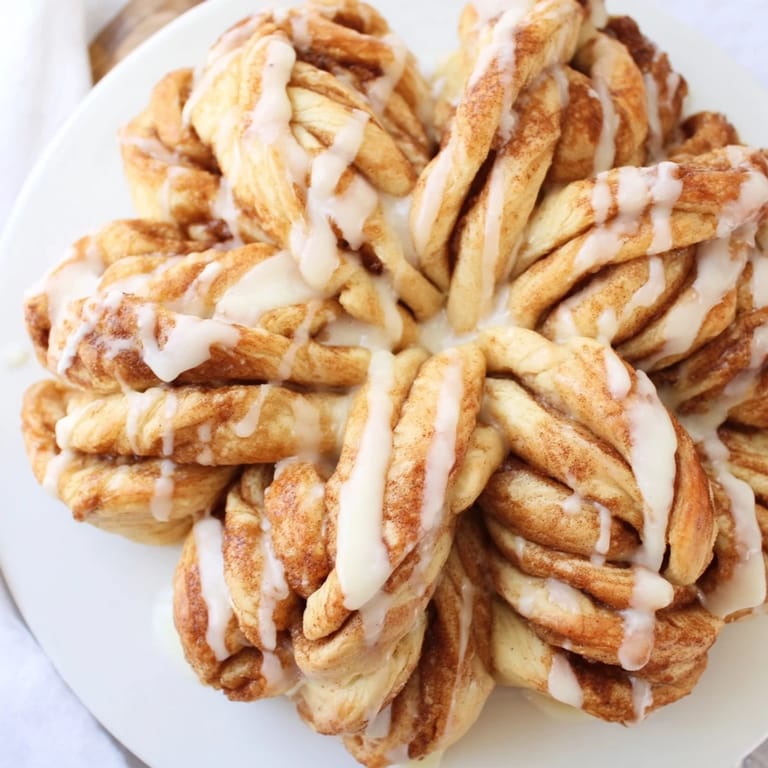 A close-up of the delicious Cinnamon Roll Pull-Apart Snowflake showing fluffy, spiraled layers.