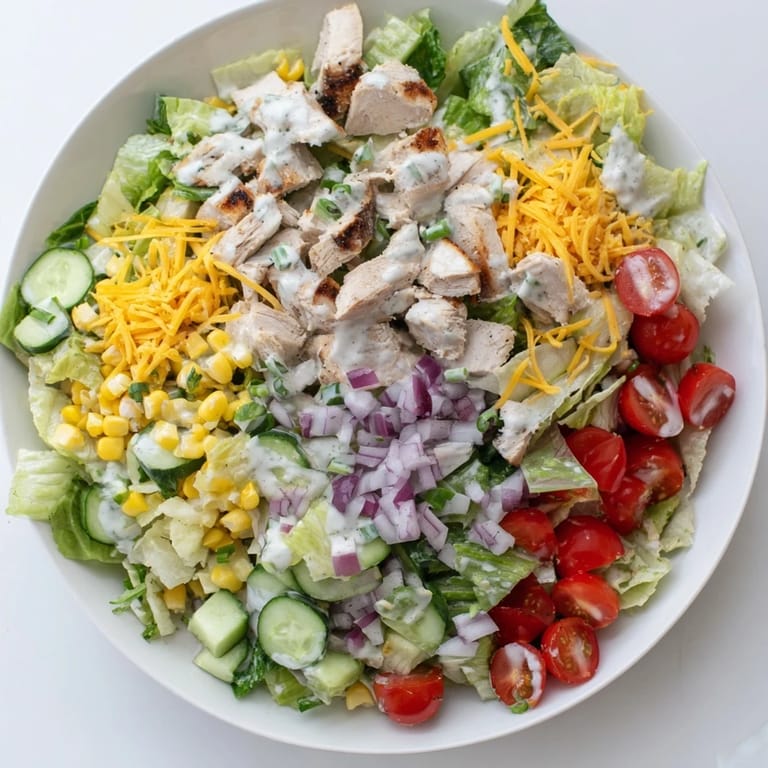 Enjoy this hearty Ranch Chicken Chopped Salad for lunch or dinner, combining juicy tomatoes, crunchy cucumbers, and fresh herbs in every bite.
